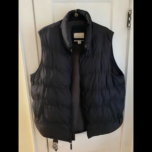 Used black bubble vest with pockets of upside and one inside vest. XL